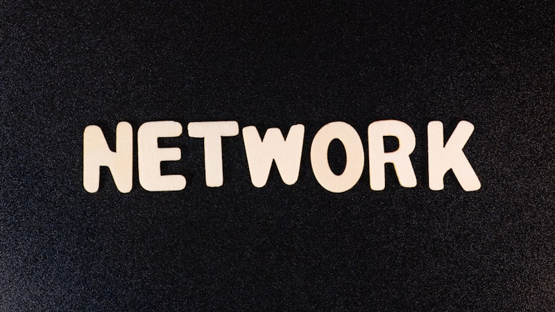 a close up of the word network on a black surface