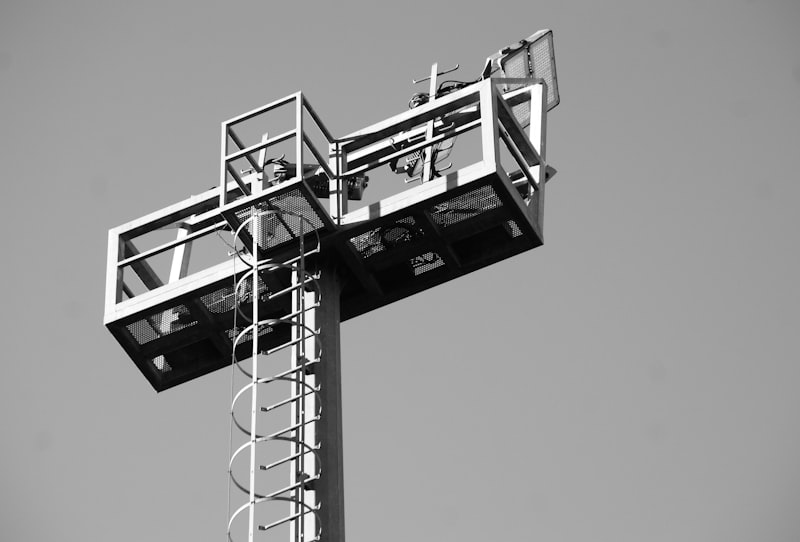 A tall metal structure with lights and a ladder.