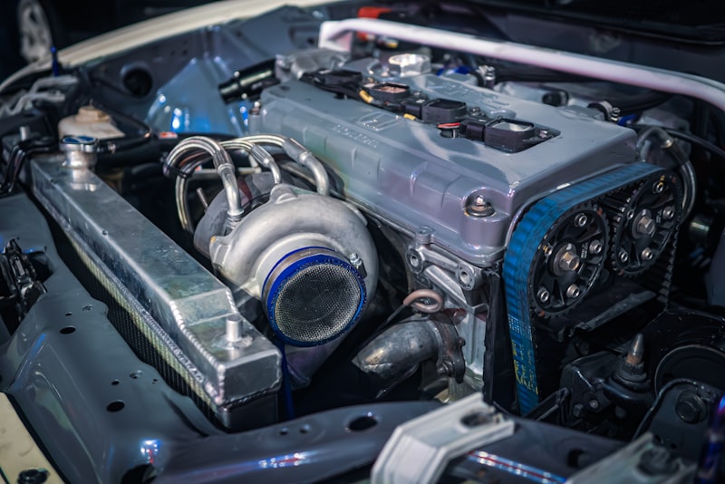 The engine compartment of a car with the hood open