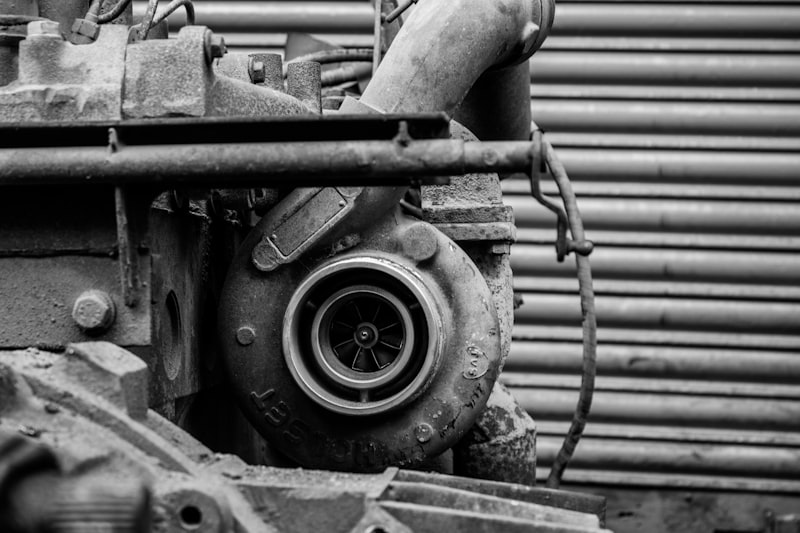 gray vehicle engine beside roller shutter