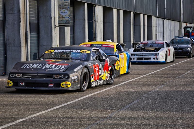 Race cars lined up on asphalt track
