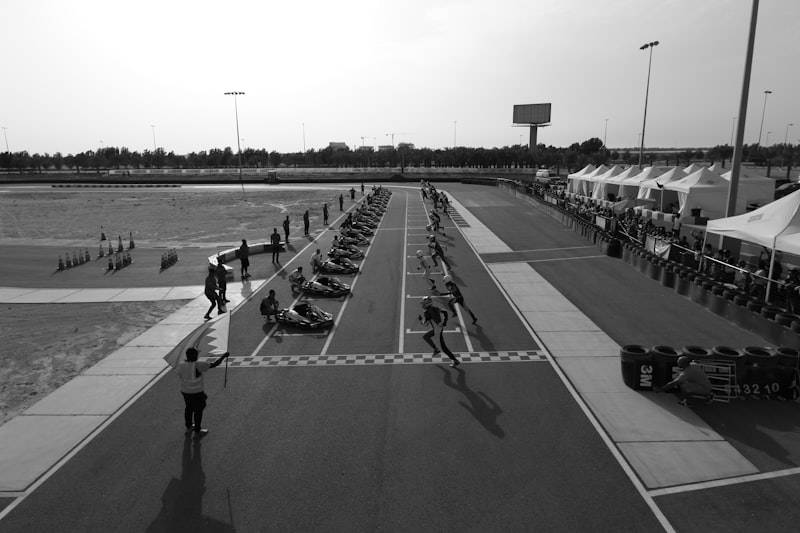 grayscale men lying on ground