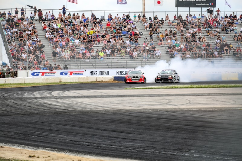 white and red racing car on track during daytime