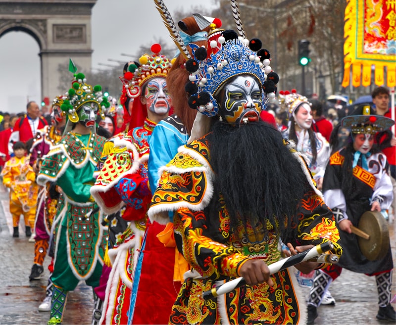 Performers in elaborate costumes during a parade