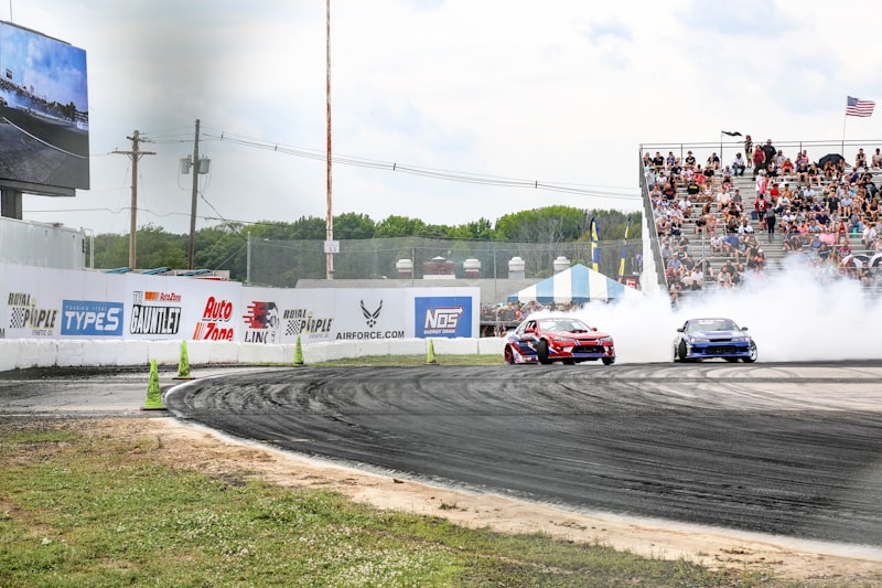 red and white racing car on track during daytime