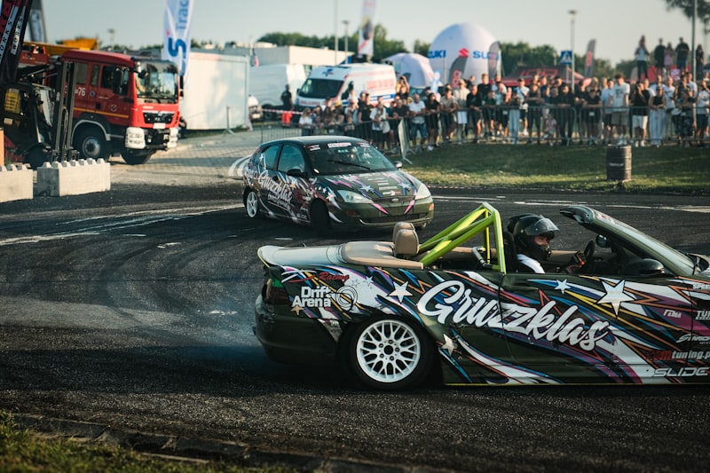 A couple of cars that are sitting in the dirt