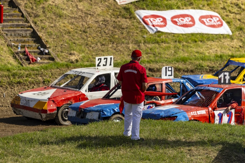 A man standing in front of a group of race cars