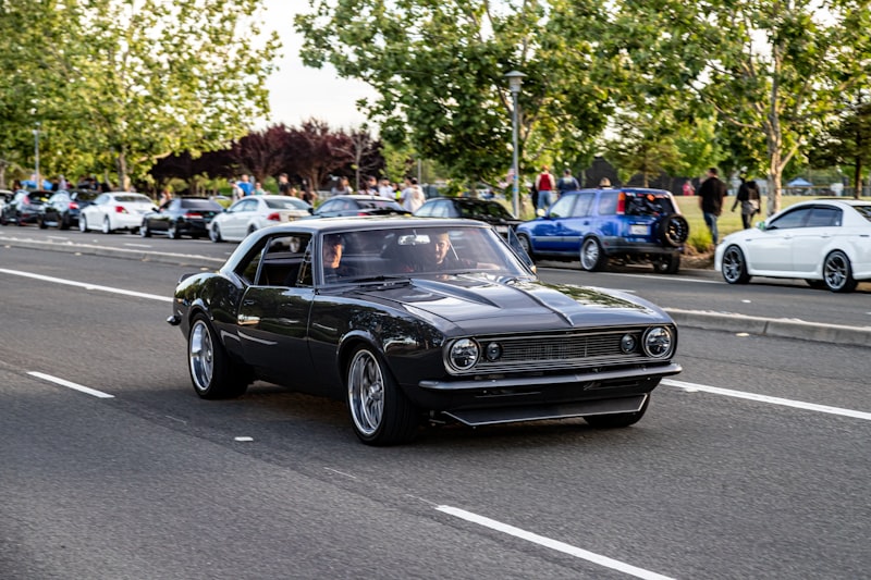 black mercedes benz coupe on road during daytime