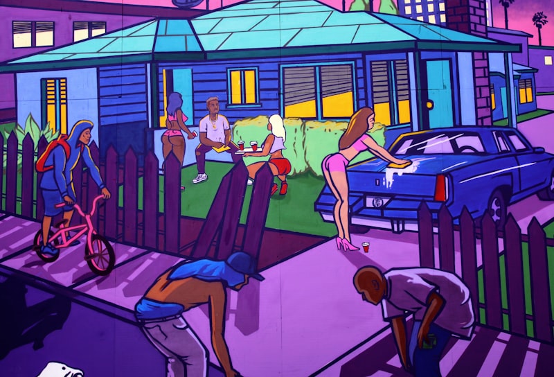 man in blue t-shirt and blue denim jeans sitting on chair beside woman in blue