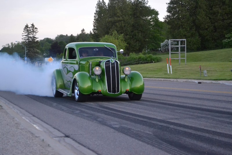 a green truck with smoke coming out of it