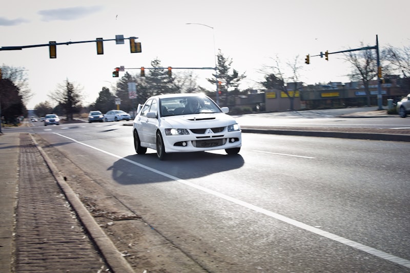 white car on road during daytime