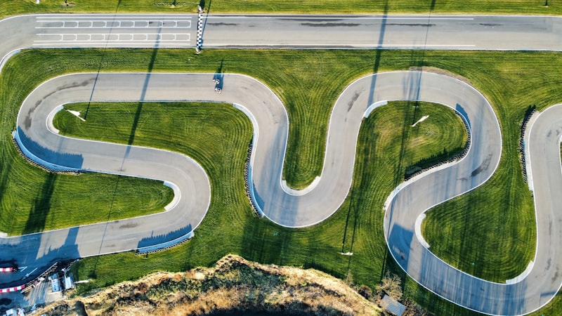 an aerial view of a winding road in the countryside