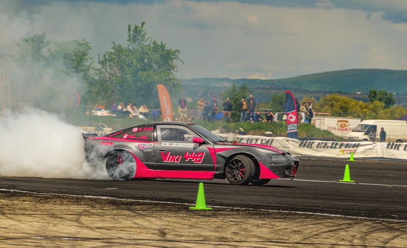 a pink car with smoke coming out of it