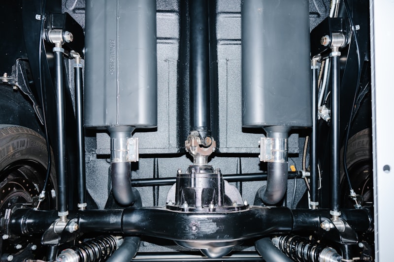 Underside view of a classic car's exhaust system.
