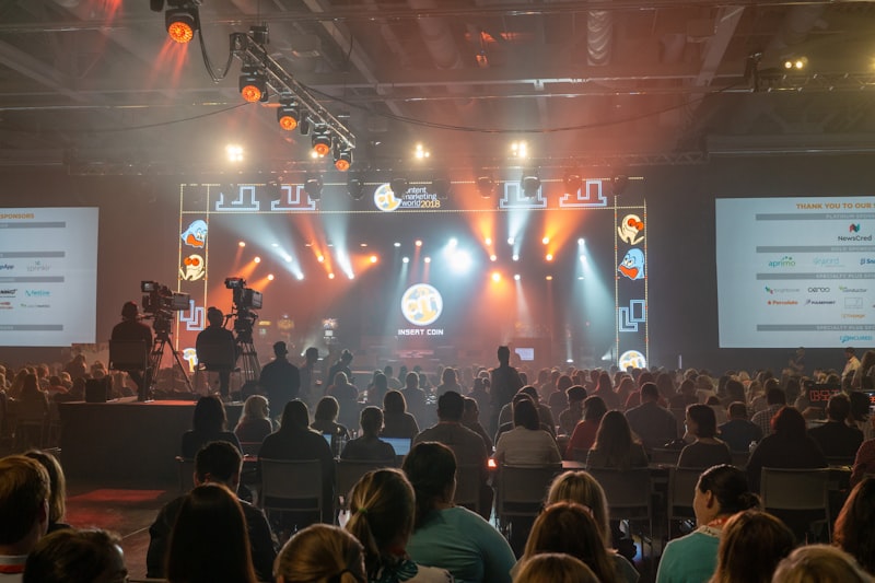 group of people standing beside stage close-up photography