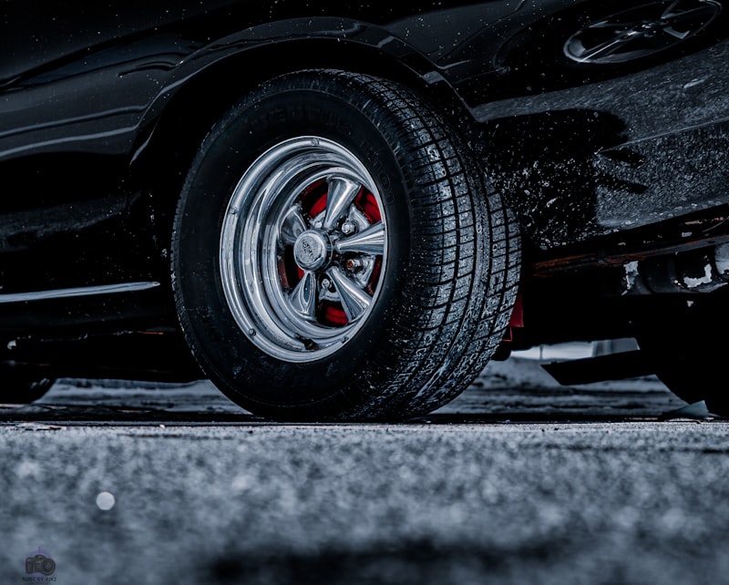 a close up of a tire on a black car