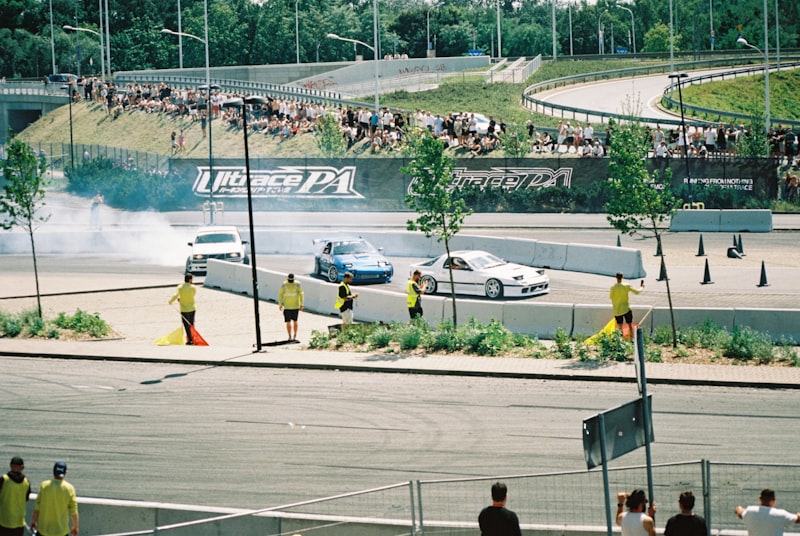 Cars are drifting in a professional race track.