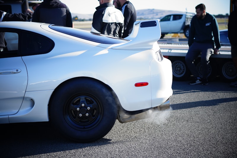 a white sports car with its hood down