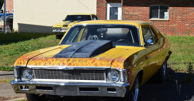 Yellow classic car with flame accents and scoop