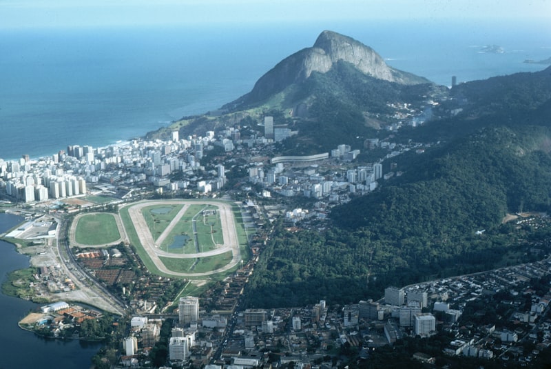 Aerial view of a coastal city with mountains and ocean