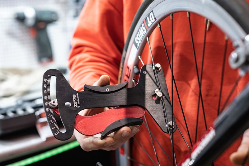 a close up of a person holding a bike wheel