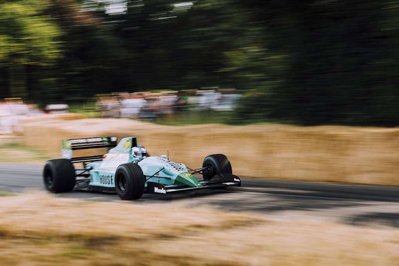 blue and green formula 1 vehicle