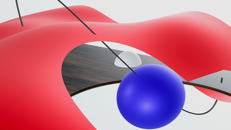 a computer mouse connected to a red and blue object