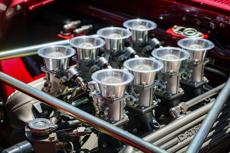 a close up of a car's engine with many silver cups
