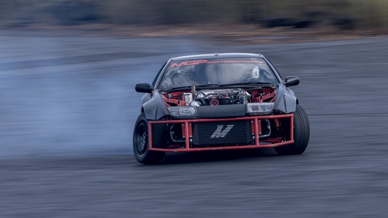 a red race car on a road