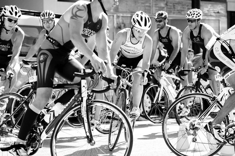 group of men riding on bicycle