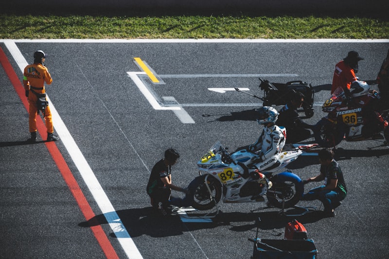 a person on a motorcycle on a race track