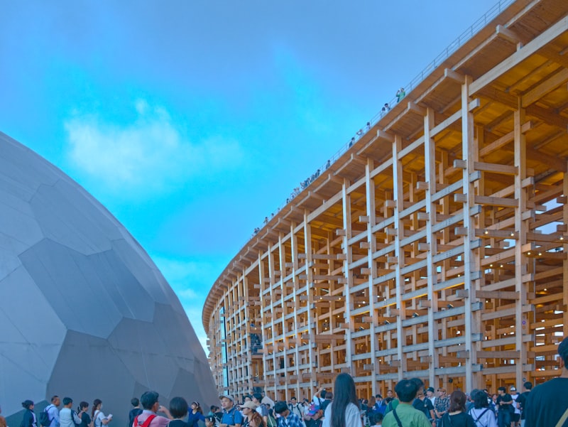 Large wooden structure with people gathered below