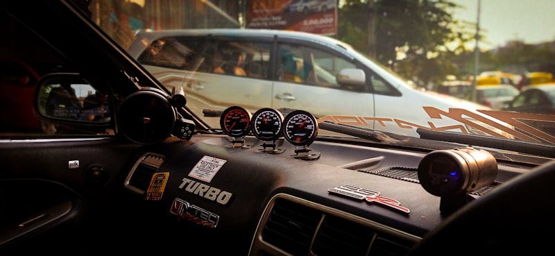 the dashboard of a car with three gauges on it