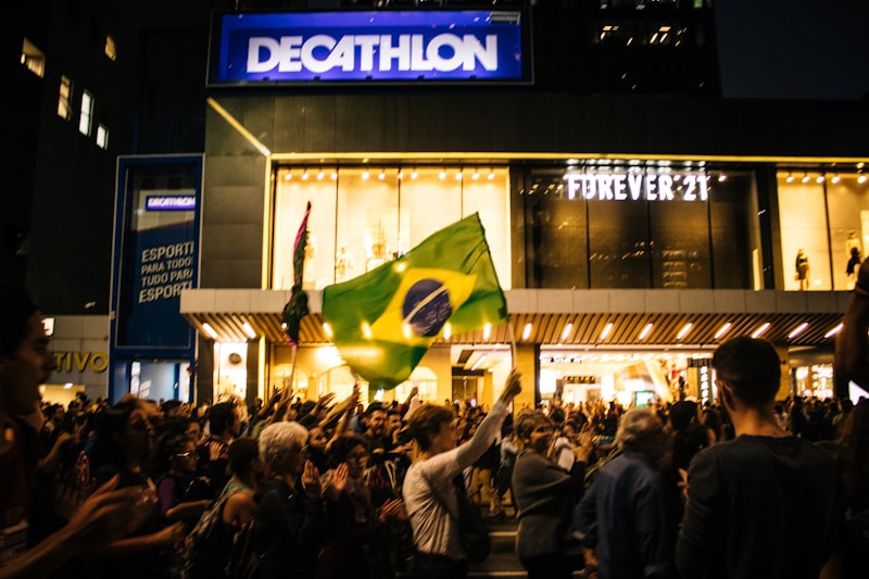 a crowd of people standing in front of a building