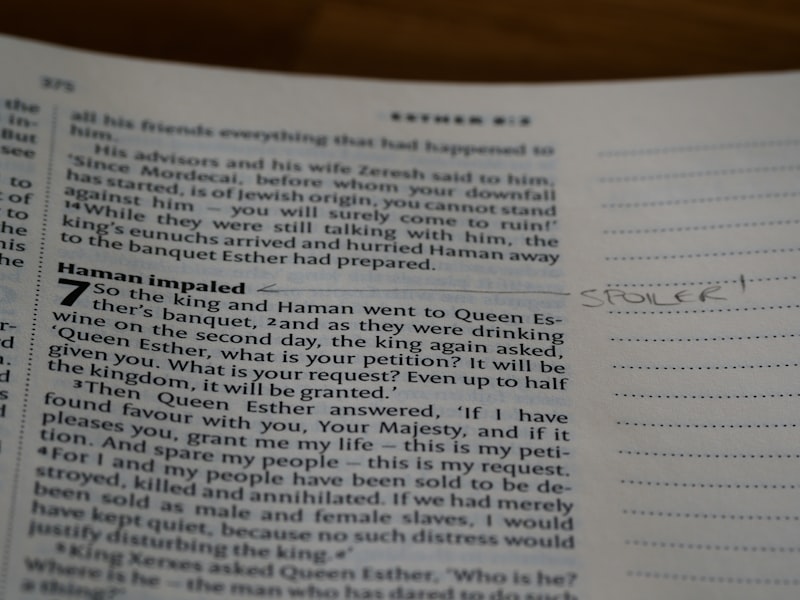a close up of an open book with writing on it
