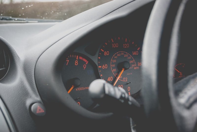 closeup photography of vehicle cluster panel