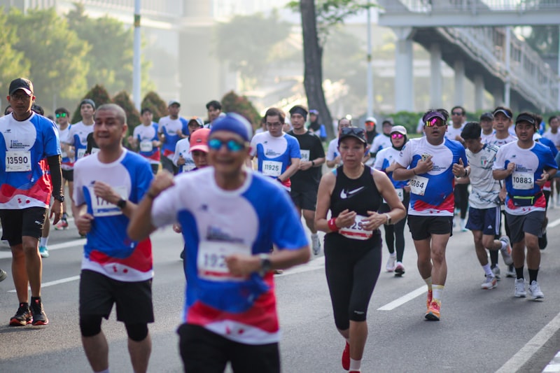 A large group of people running down a street