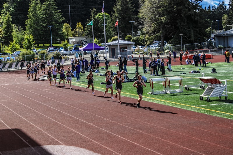 a group of people running on a track