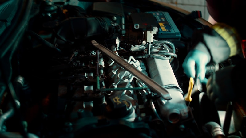 A man working on a machine in a garage